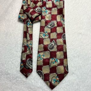 Donald Duck tie .. main color is burgundy and tan, Mickey Unlimited brand